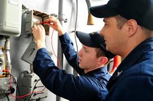 Electricians fixing wiring