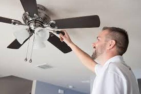 electrician installing Ceiling Fan
