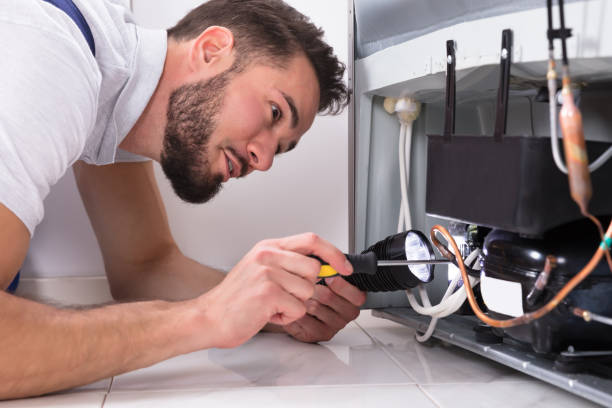 electrician fixing appliance
