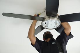 Electrician fixing celling fan